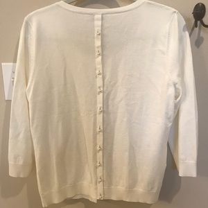 Cute cardigan with pearl buttons.